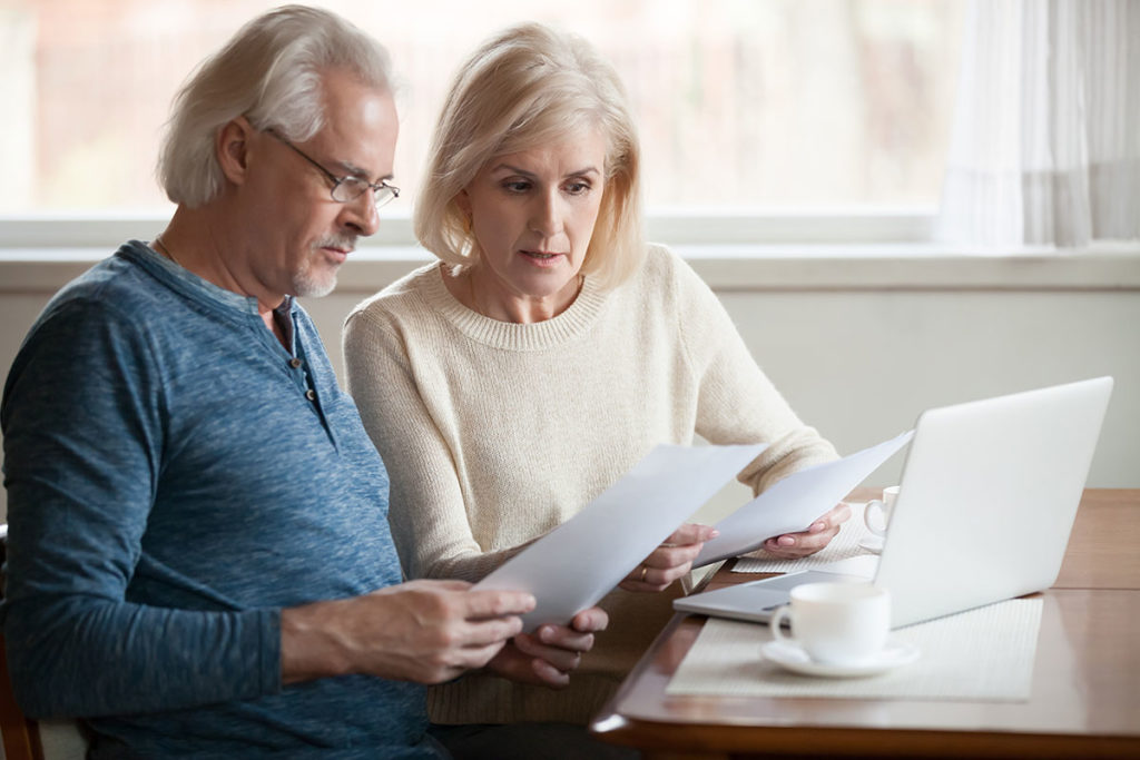 two retirees reviewing their portfolios in the wake of the SECURE Act changes