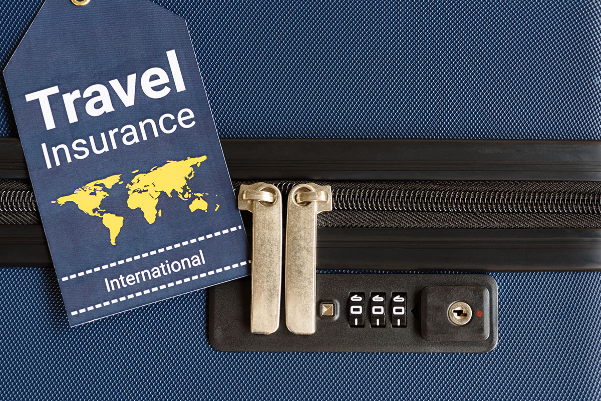 suitcase with travel insurance to represent financial tips for traveling